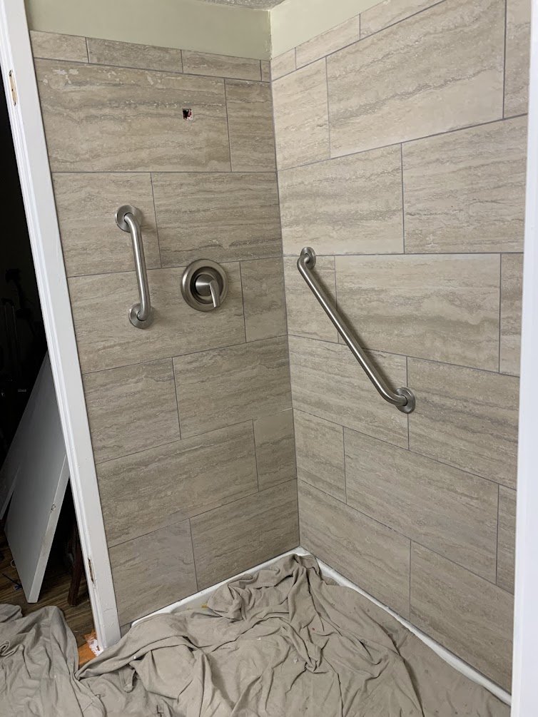 In Progress: Installing stainless grab bars and next is a handheld accessibility showerhead
