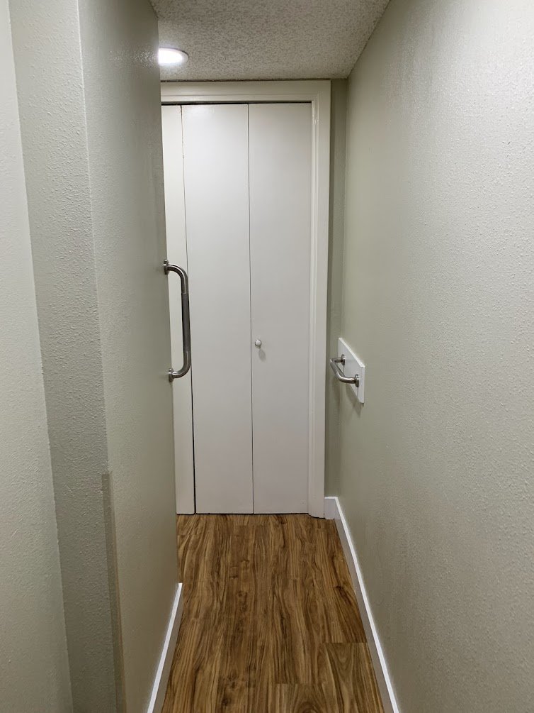 Durable vinyl plank flooring installed & Safety grab bars