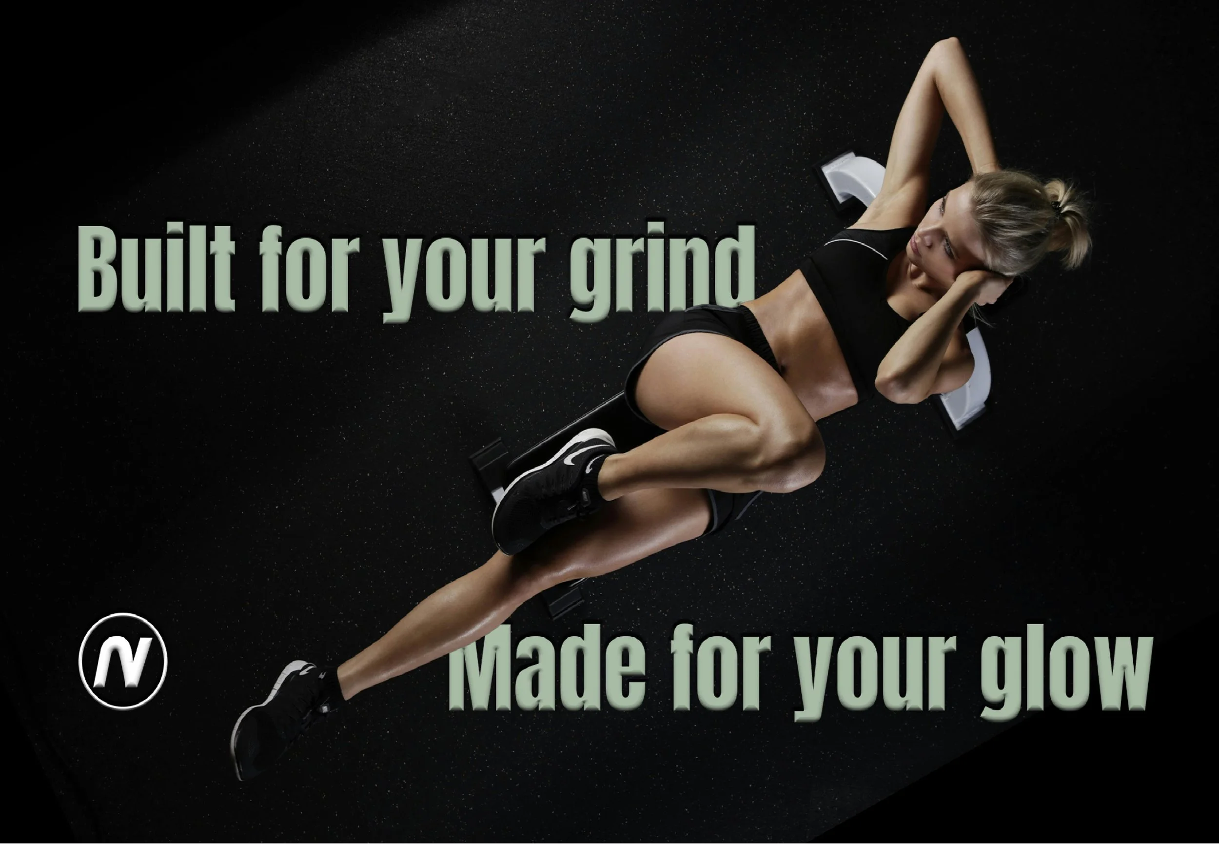 A woman lying on a black workout mat in a gym, wearing black athletic clothes and shoes, with the text 'Built for your grind' and 'Made for your glow' overlaid.