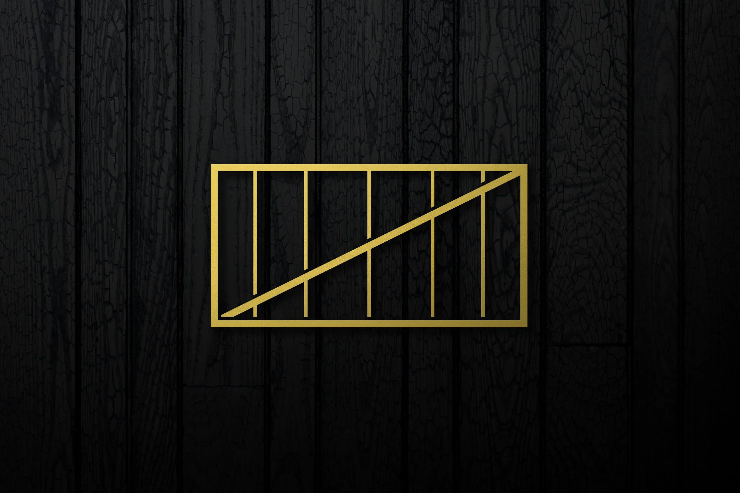 A black textured background with a gold line drawing of a bar chart with an upward trend.