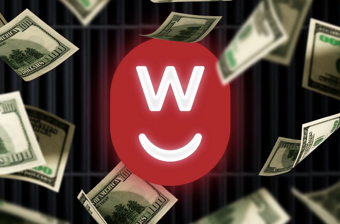 Red smiling face with the letter W on top, surrounded by falling hundred-dollar bills against a dark background.