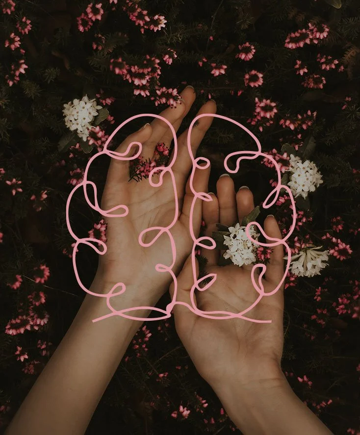 Two hands with palms facing outwards resting on a bed of pink and white flowers and green plants with a pink illustration icon of a brain