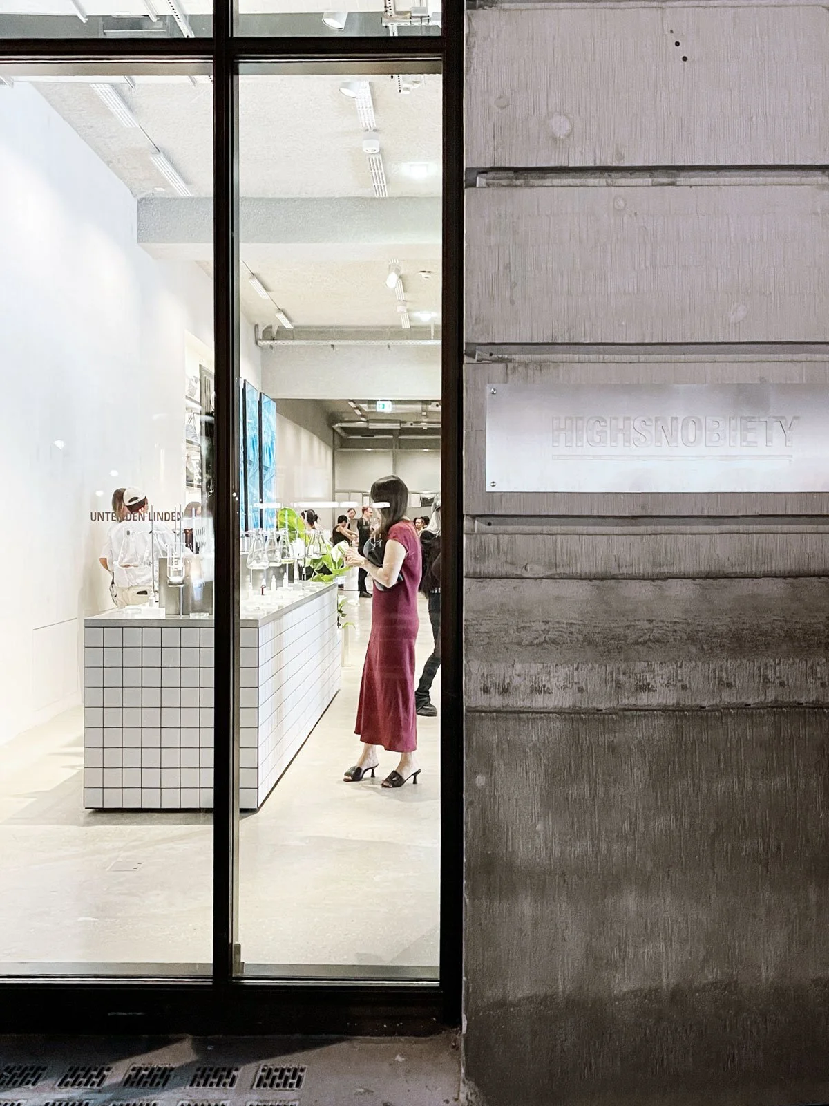 Entrance view of the Highsnobiety Store Berlin revealing tiled display counter with laboratory-inspired product staging for The Ordinary x Highsnobiety temporary showroom, display design and props styling by Steffi Bühlmaier, event production by PS:K