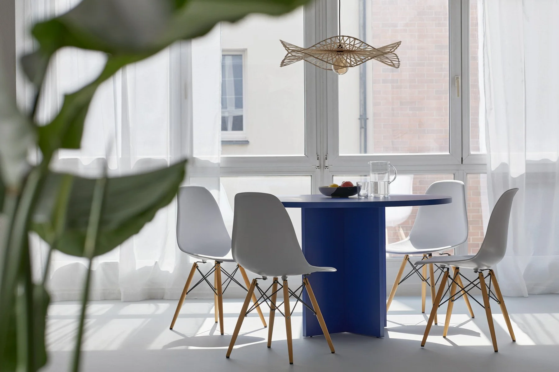 Living room with neutral sofa and green artwork, view into bedroom, apartment in Berlin Mitte, interior design, Innenausbau, Ausstattung and styling by Steffi Bühlmaier, photography by Tobias Bärmann, 2024