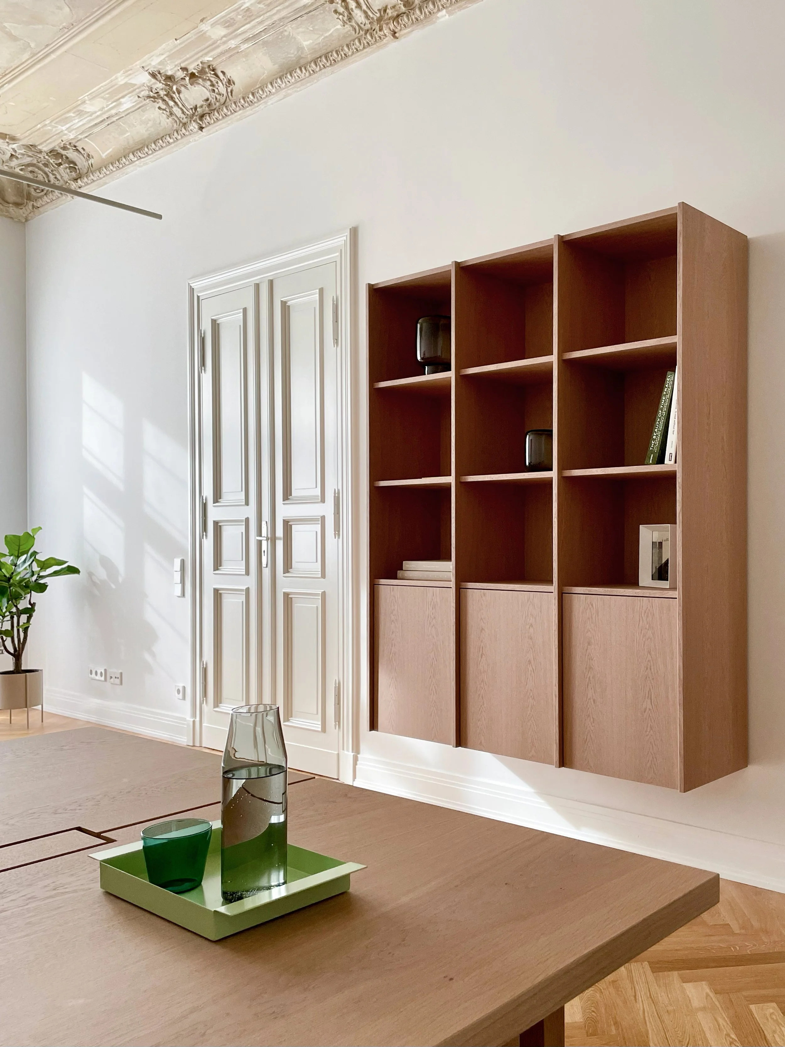 Minimal office shelving with oak cabinetry and decorative objects, workspace in Berlin Charlottenburg, interior styling by Steffi Bühlmaier, architecture by BBPA, 2024