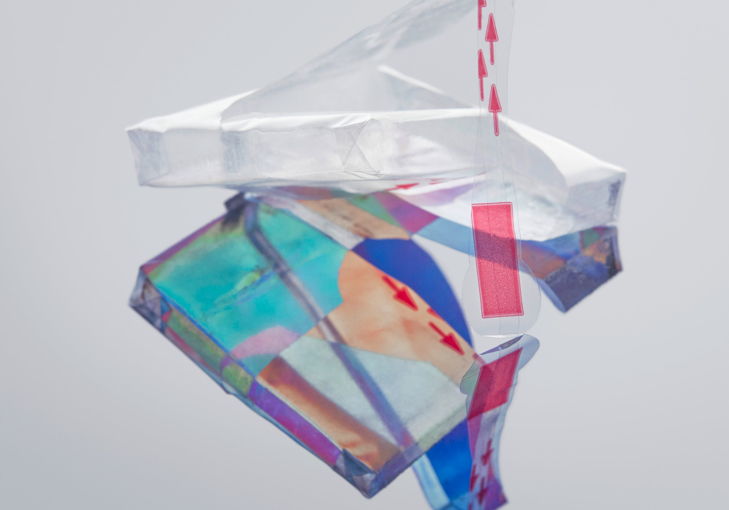 Abstract composition of packaging foil dispersing light into spectral colors through refraction, props styling by Steffi Bühlmaier, photography by Tobias Bärmann, postproduction by Studio Wolfram, published in Slanted 38, 2018