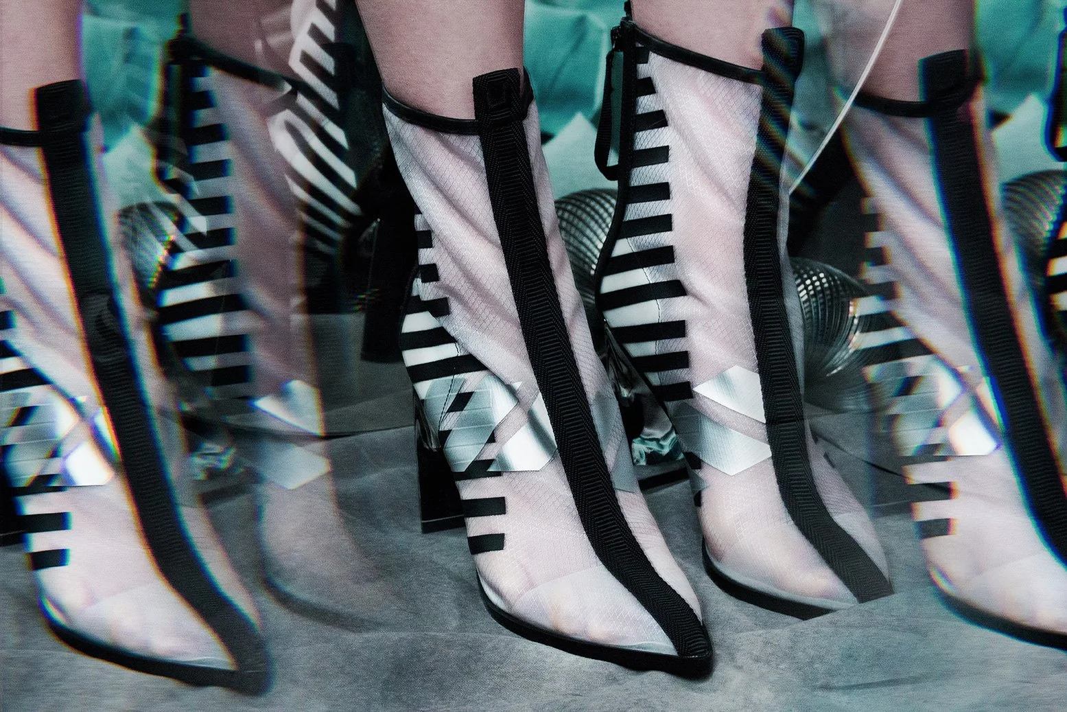 Editorial fashion image featuring transparent graphic ankle boots multiplied through prism reflections, set design and props styling by Steffi Bühlmaier, photography by Loreen Hinz for Vision Magazine China, 2019