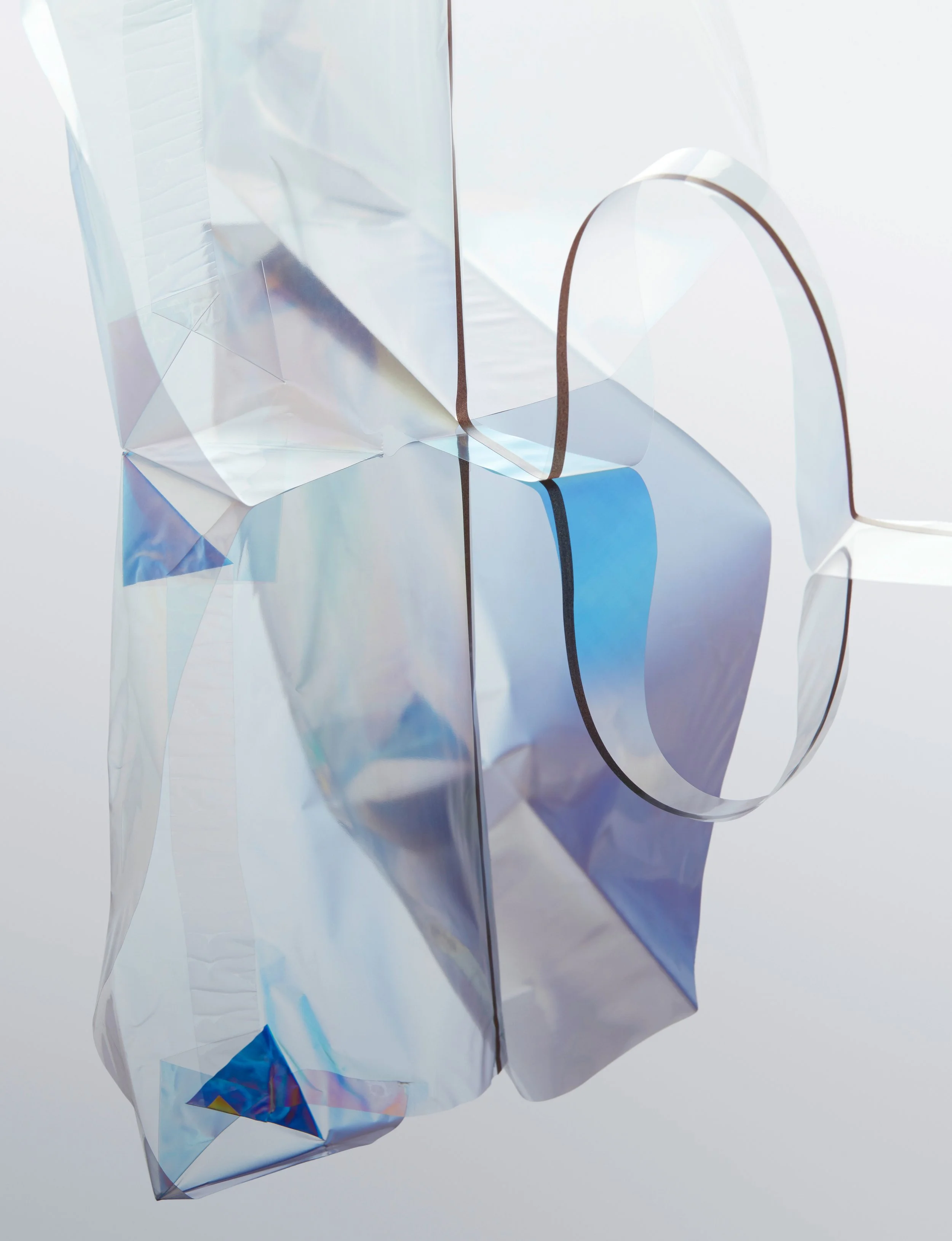 Still life with folded translucent packaging material creating prismatic light effects, props styling by Steffi Bühlmaier, photography by Tobias Bärmann, postproduction by Studio Wolfram, published in Slanted 38, 2018