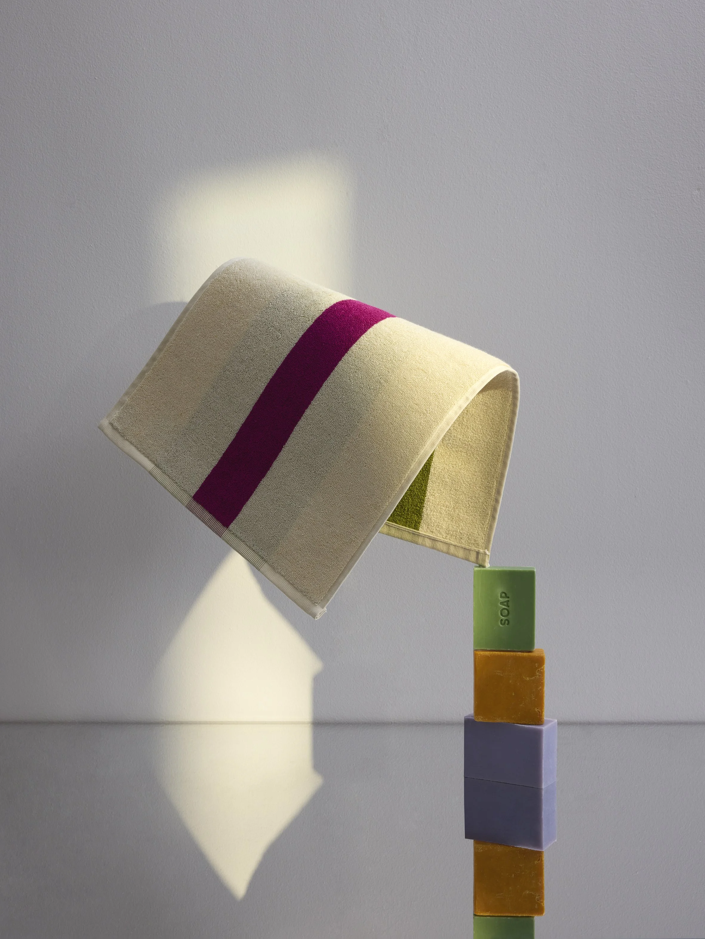 Sculptural towel still life with stacked soap bars – art direction and props styling by Steffi Bühlmaier, photography by Anne Deppe