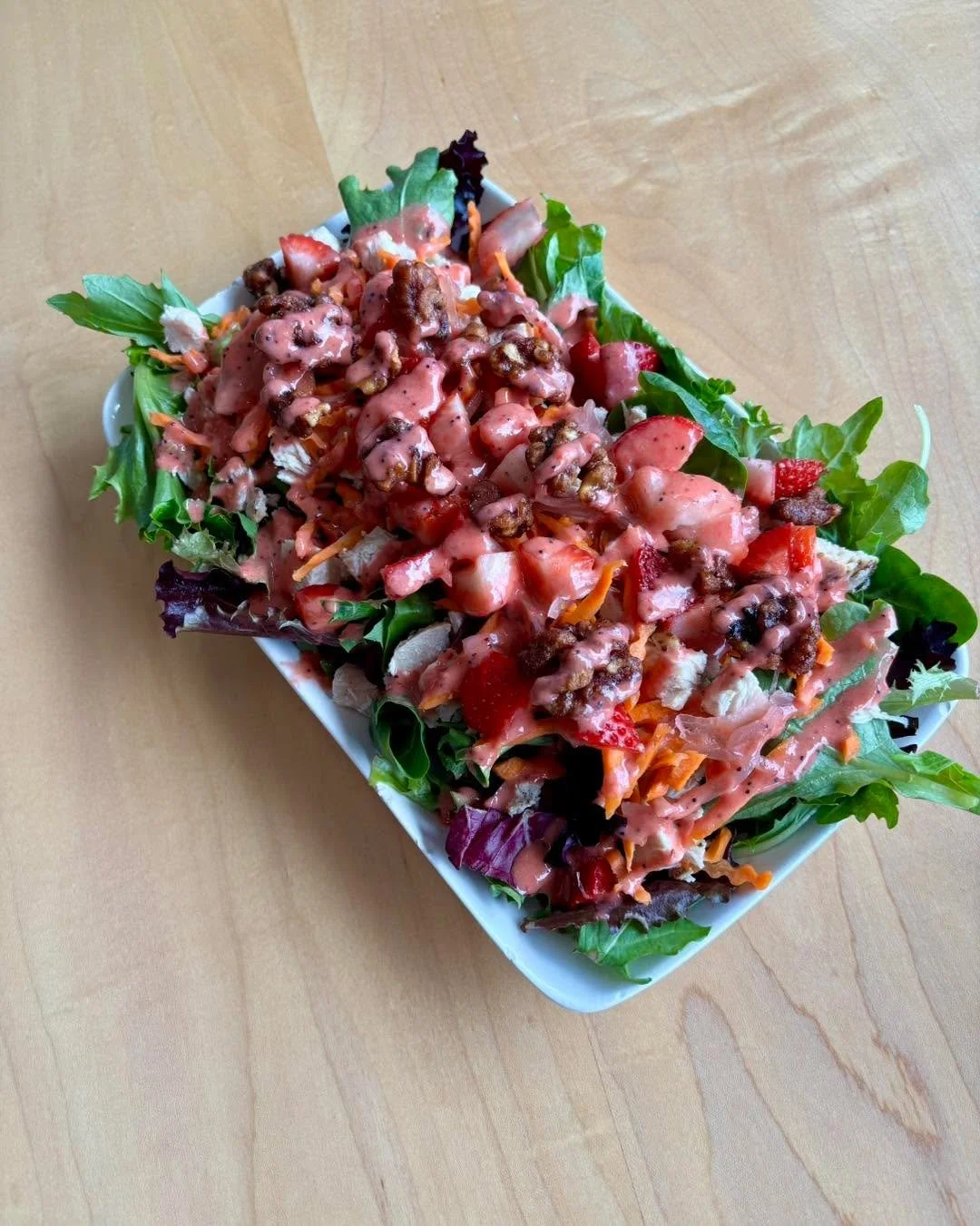 🍓✨ Meet Strawberry Fields ✨🍓

Sweet strawberries, fire-braised chicken, glazed walnuts, @madpicklecompany pickled red onions, carrots, and our scratch-made strawberry vinaigrette over fresh spring mix.

Available as a salad or wrap&mdash;fresh, cru