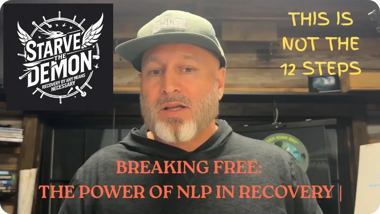 A man with a beard and gray cap speaking in front of a wooden wall. Text overlays include a black square with a logo that says "Starve the Demon" and "Recovery by any means necessary," a yellow text that says "This is not the 12 steps," and an orange