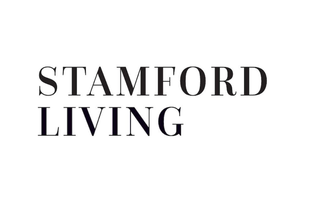 Black background with the words 'Stamford Living' in large, elegant font, with 'Stamford' in dark gray and 'Living' in dark purple.