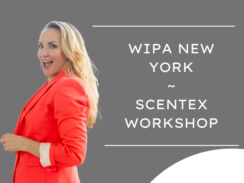 Smiling blonde woman (Tiffany Rose Goodyear) in a coral blazer standing next to a graphic with text about a Scentex workshop in New York.
