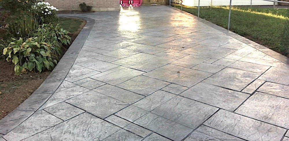 Impressive-Concrete-Concrete-Driveways-Portfolio-001-Stamped-Concrete-Yorkstone-Pattern-Two-Colors-Driveway.jpg