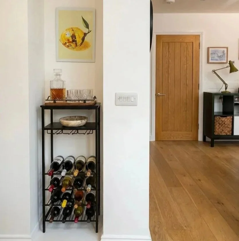 Hallway with industrial wine rack and styled accessories, Oxford family home interior design by Rodolfo Falcao