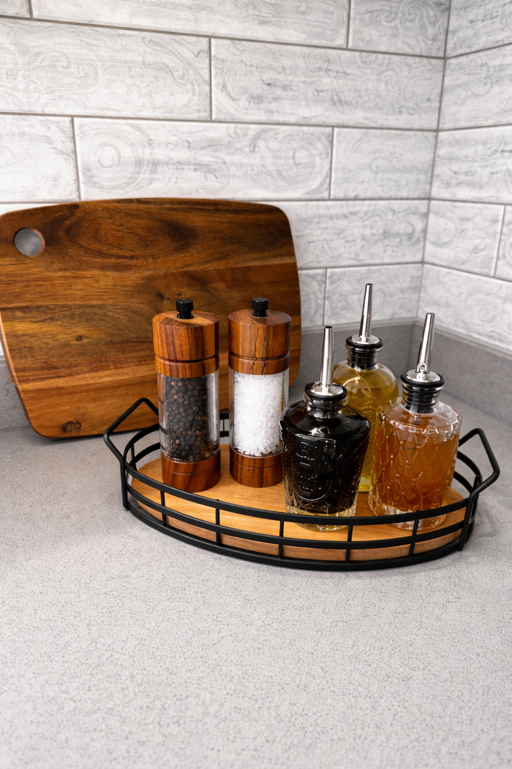 Styled kitchen counter with wooden board and condiment bottles, Oxford family home interior design by Rodolfo Falcao