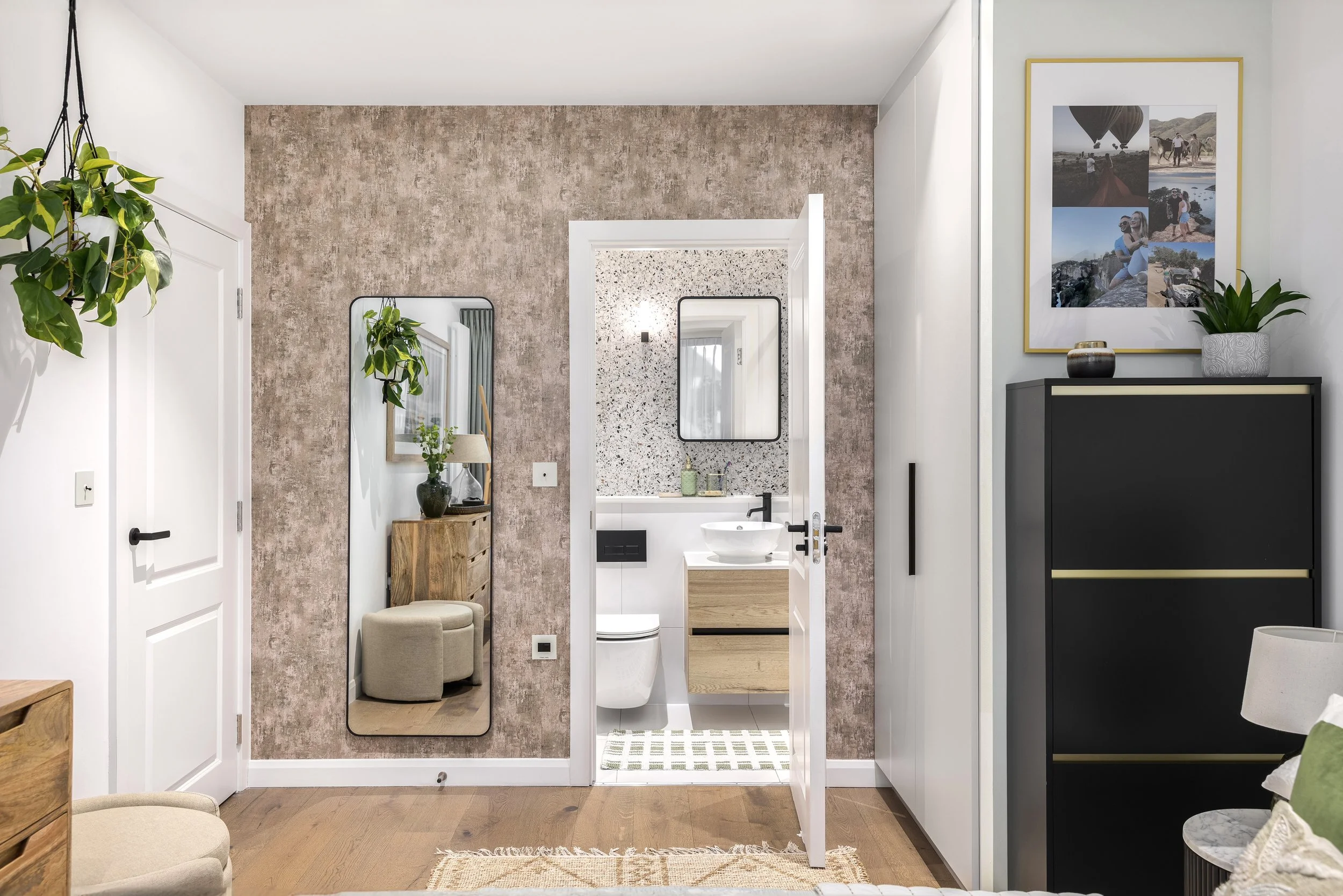 Hallway with patterned wallpaper, mirror and natural textures, Limehouse Cut London apartment by Rodolfo Falcao
