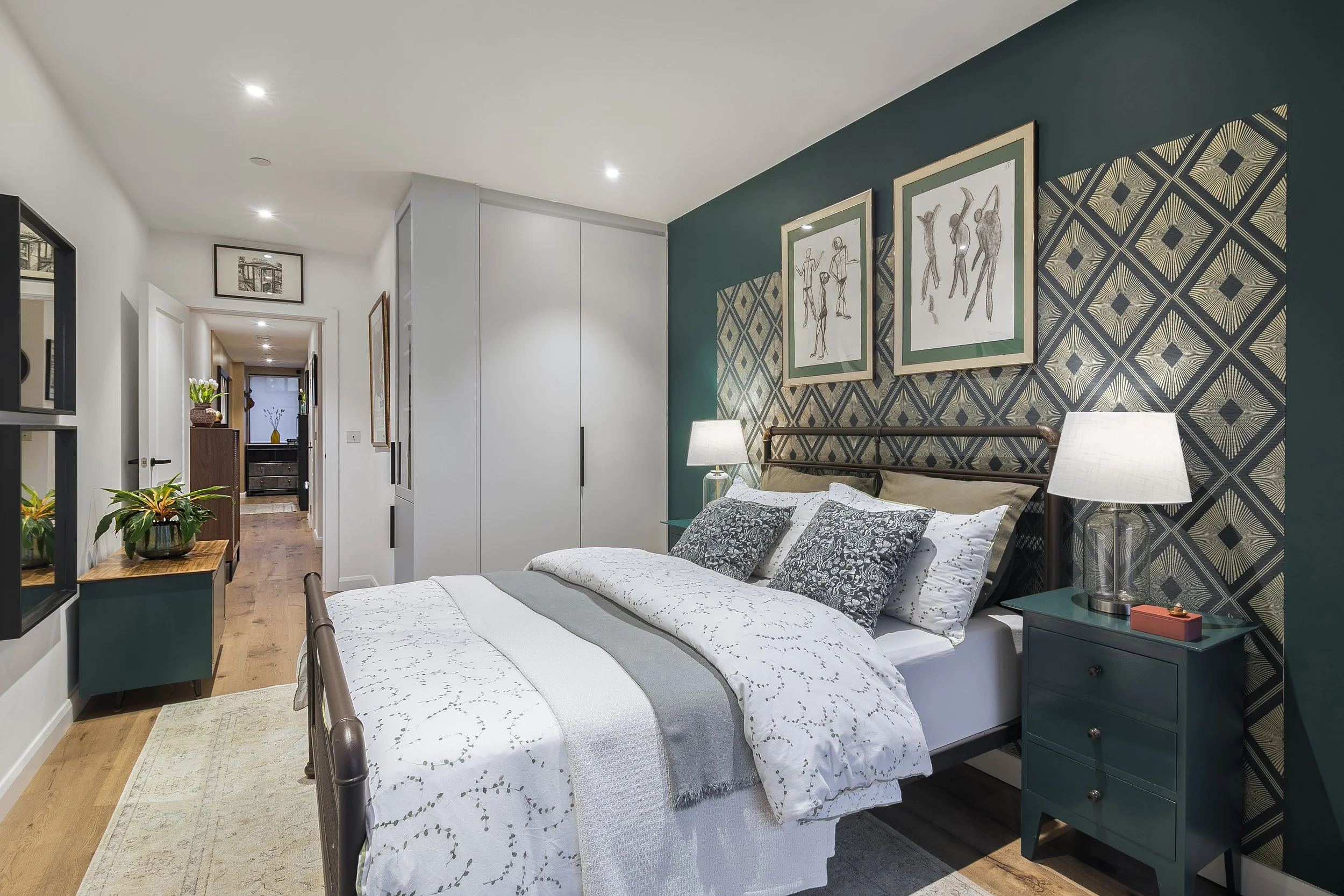 Guest bedroom with built-in wardrobes and eclectic vintage styling, Bow East London apartment by Rodolfo Falcao