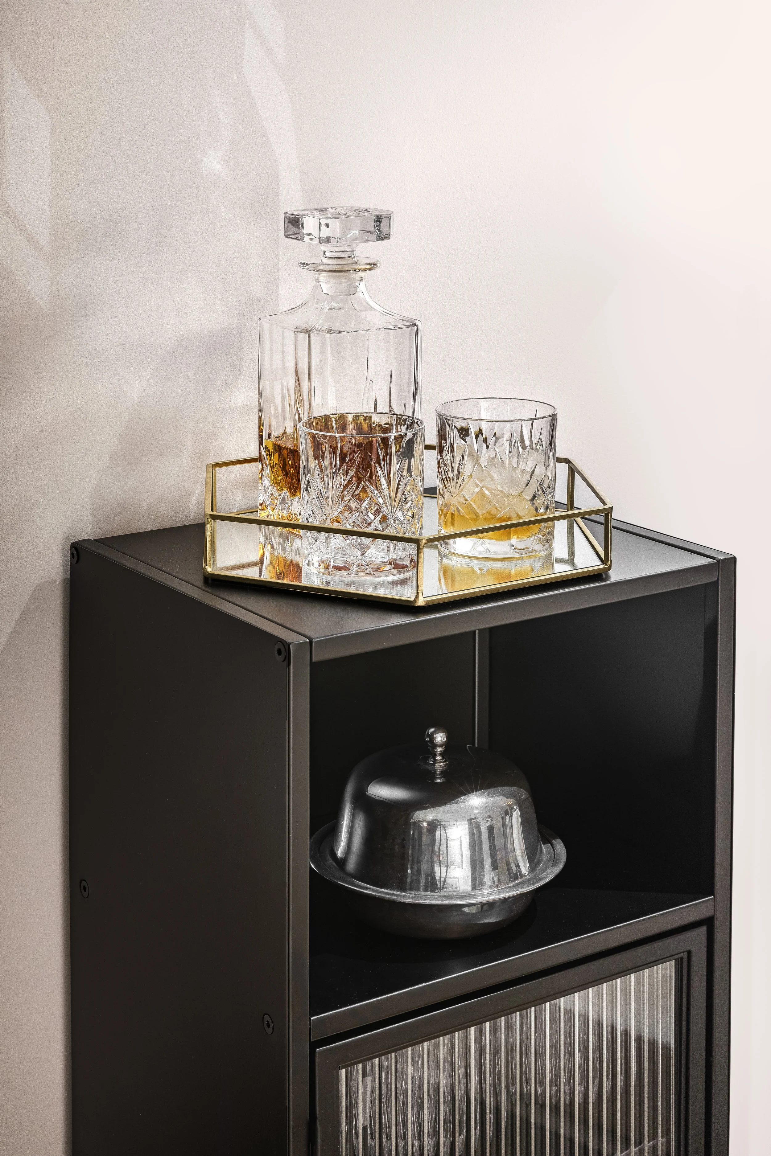 Styled drinks trolley with crystal decanter, warm minimalist interior by Rodolfo Falcao, Limehouse Cut London