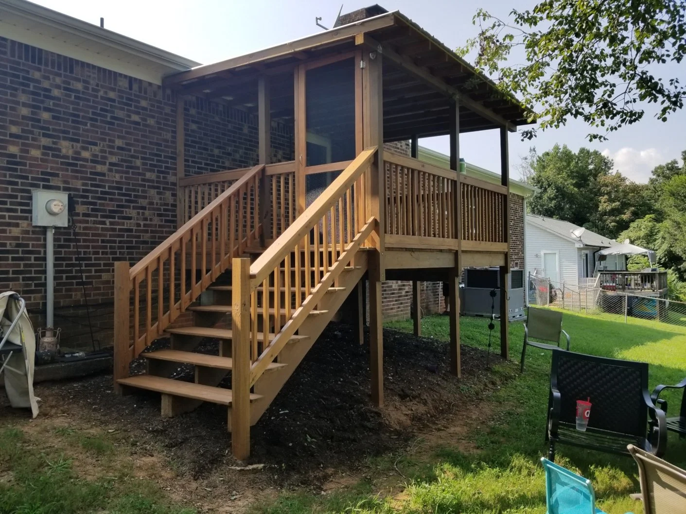 GVL painter completed pressure washing and staining of a covered deck, railings, staircase,  and posts in Easley, SC.