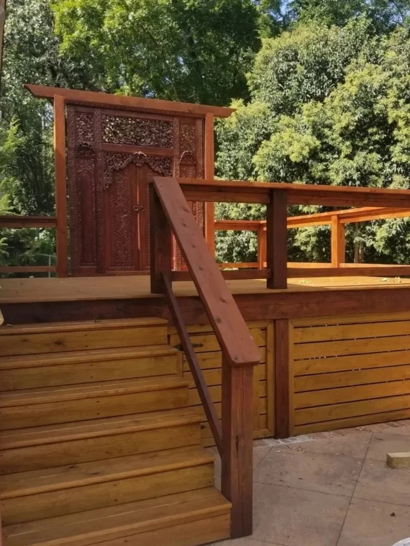 Minwax two tone stained wooden deck with stairs leading up to a platform, a decorative wooden door at the top, cedar handrails on Farrs Bridge RD, Greenville,SC