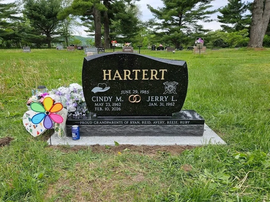 Goldstar Black Unique Monument with Gold Letters and Bronze Rings