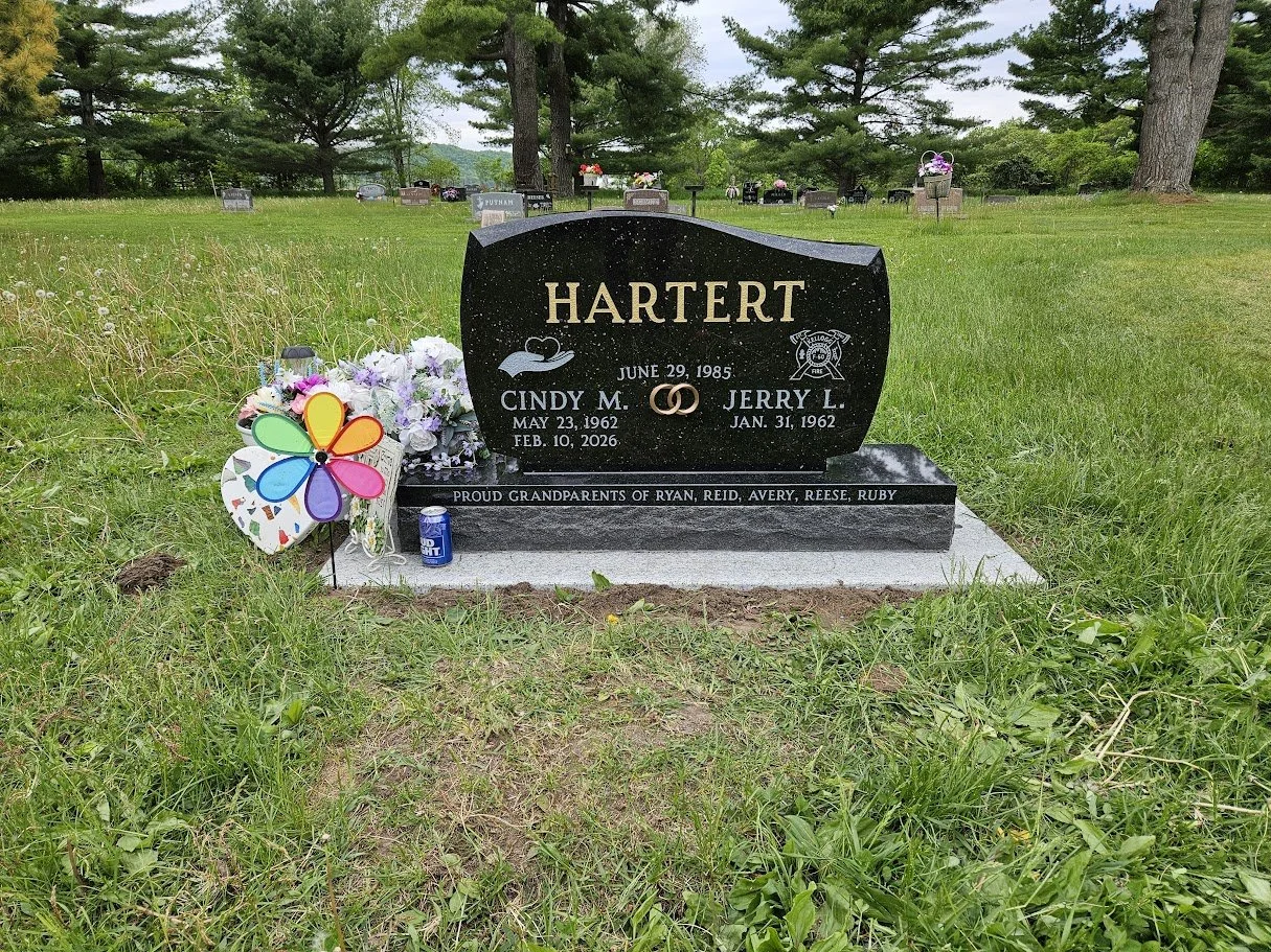 Goldstar Black Unique Monument with Gold Letters and Bronze Rings