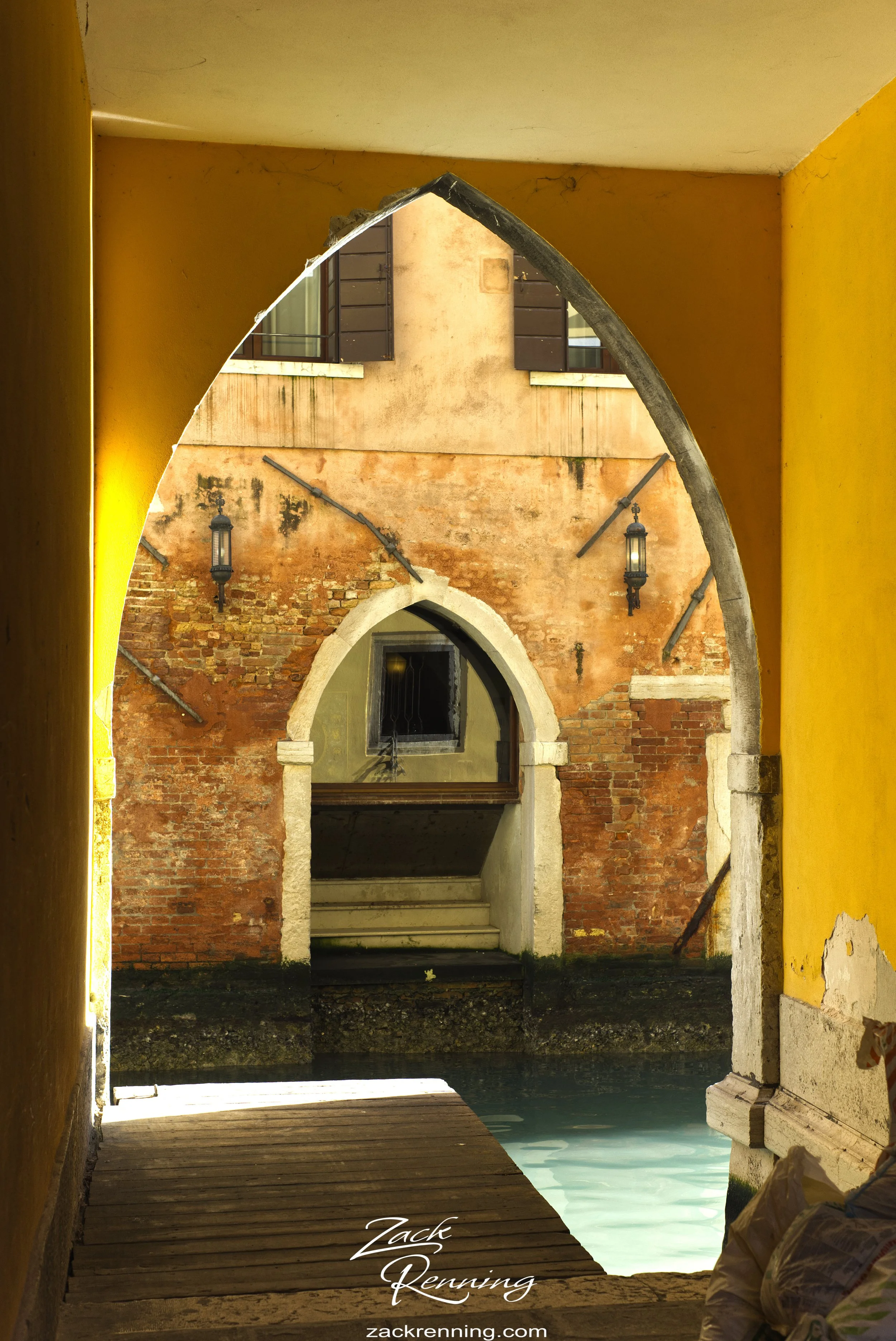 Venice was full of vibrant colors on the buildings, this archway seemingly the most vibrant as it had the morning sun illuminating it down this canal.