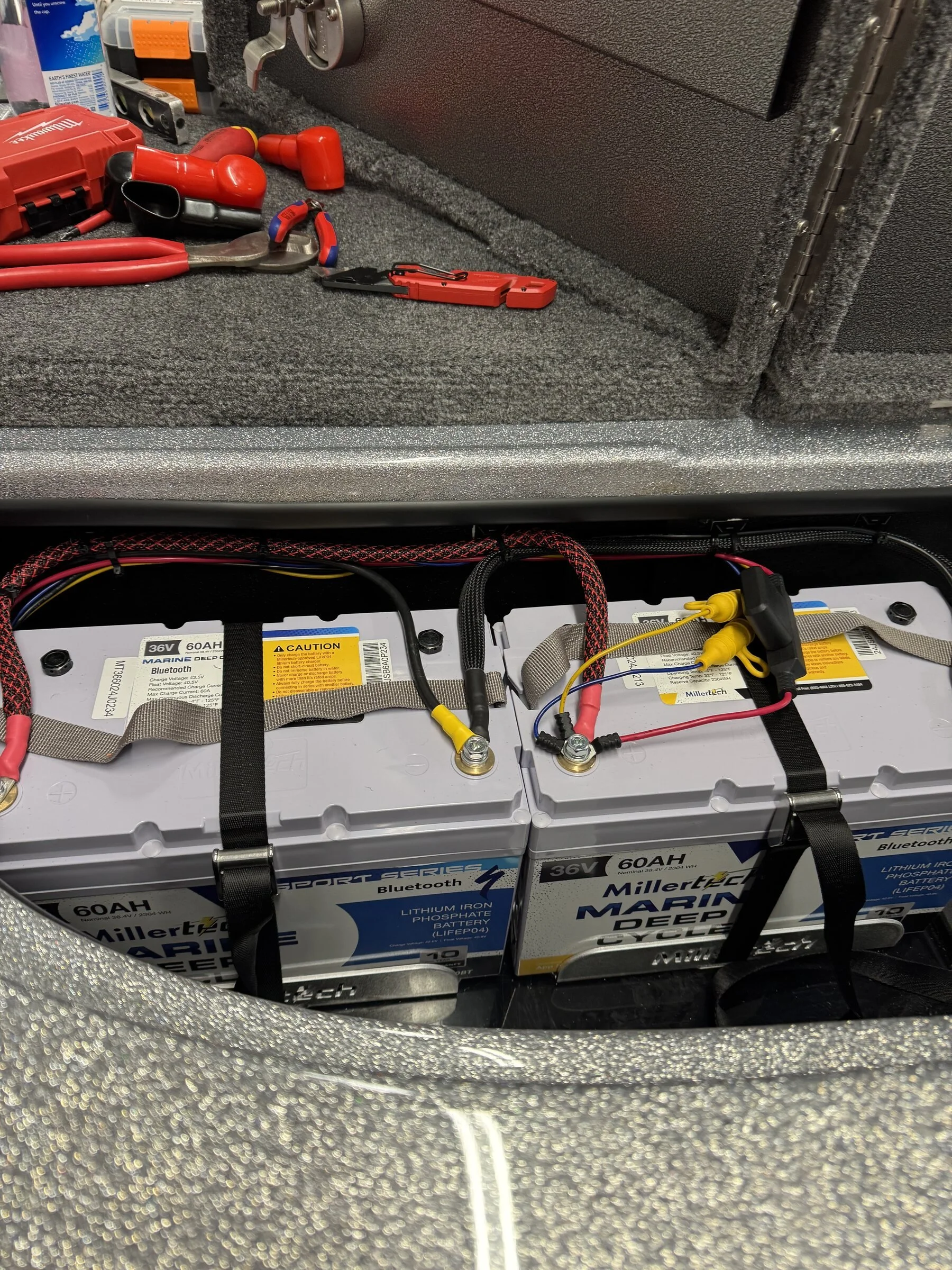 Organized lithium battery bank with labeled connections, installed for a tournament-ready power system