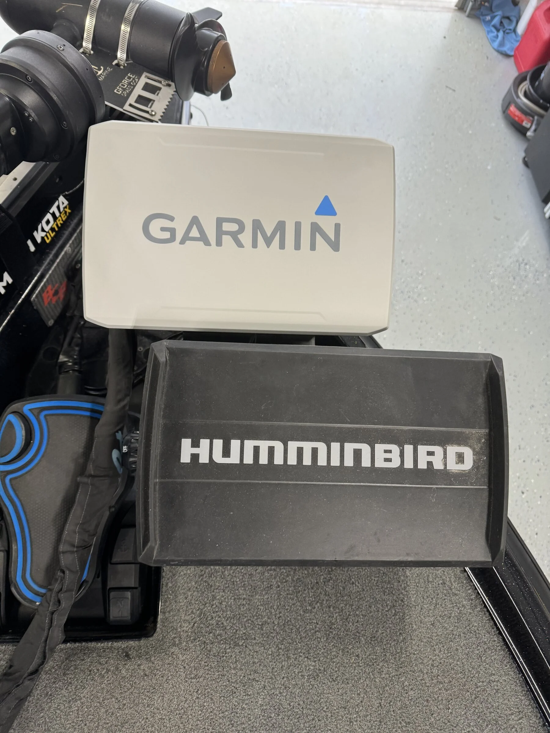 Garmin and Humminbird chartplotters ready for installation on a Waypoint Marine Technologies rigging bench