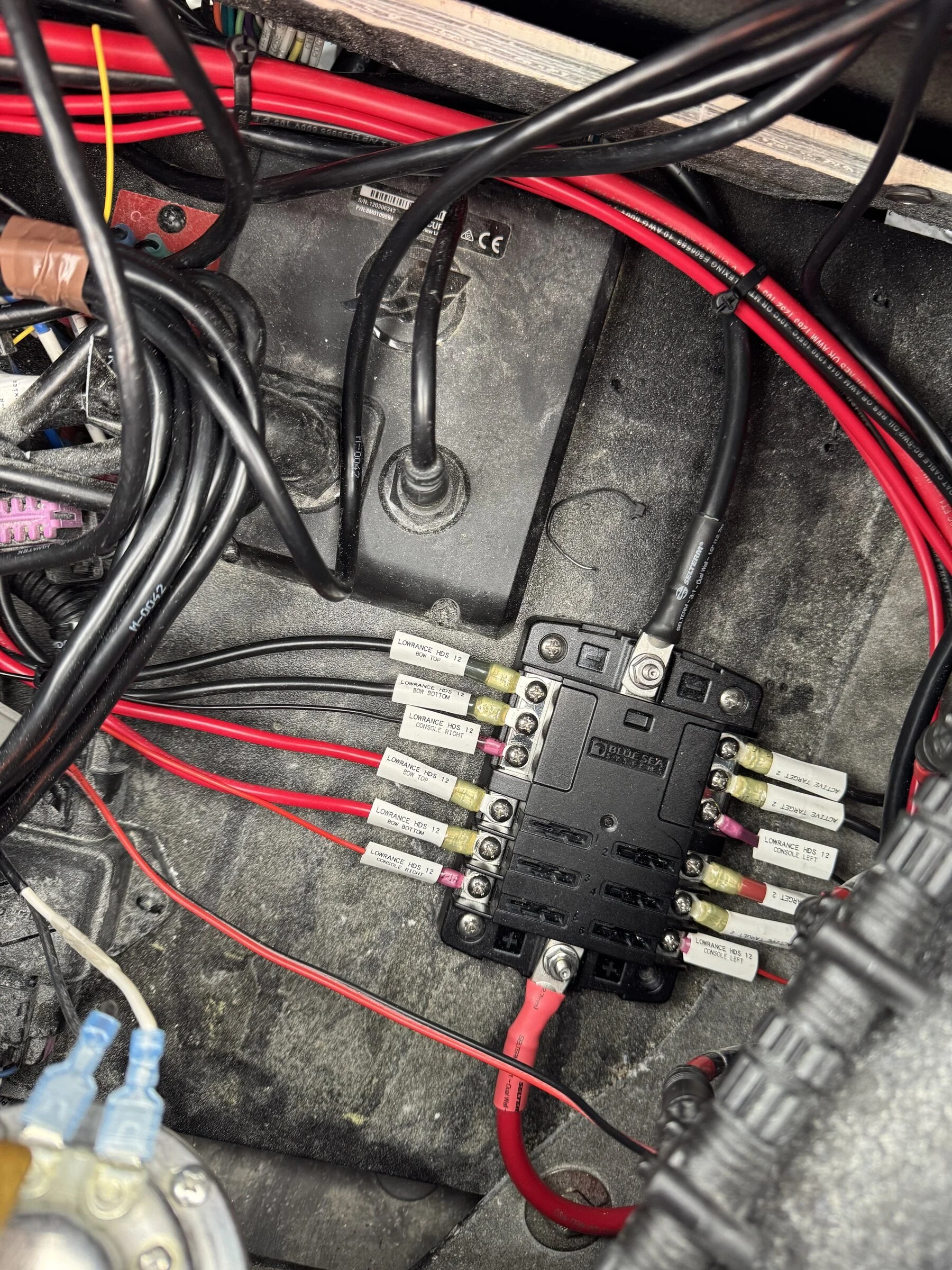 Labeled fuse block and clean wiring runs behind the console, built for long-term reliability