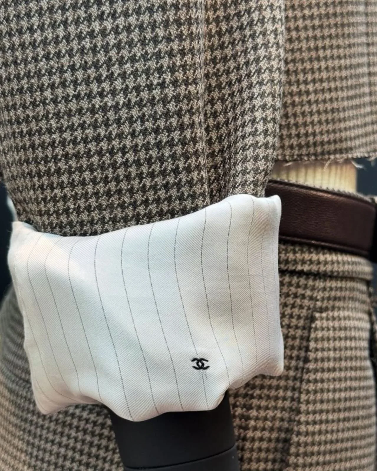 The CC on the heel. A embroidered cursive on a shirt pocket. A bag clasp you almost miss.

Chanel has never needed to announce itself. After a century of building one of the most recognisable codes in fashion, the logo becomes a whisper, and that res