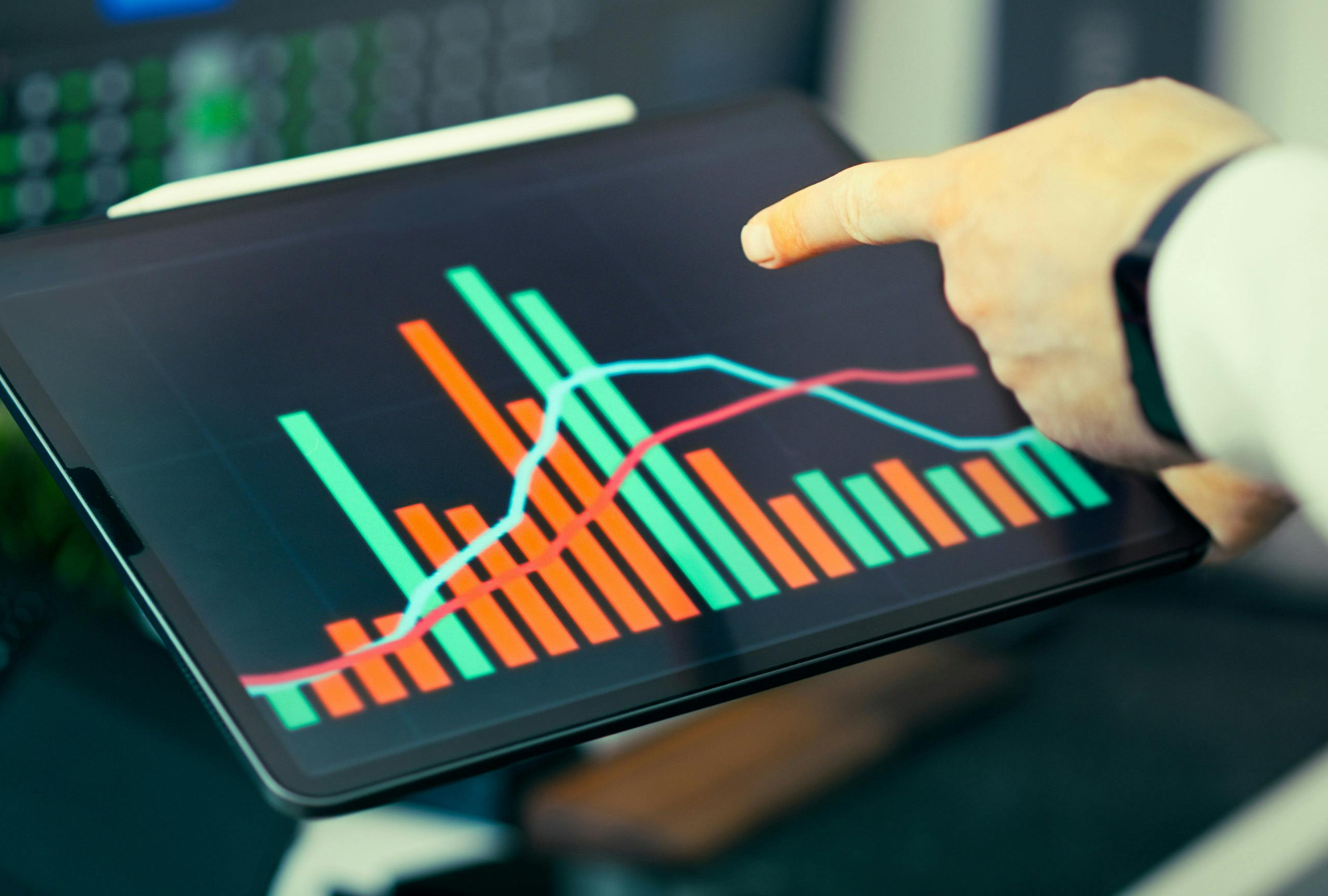 Business attorney analyzing growth chart to identify legal risks and compliance gaps for small business owner