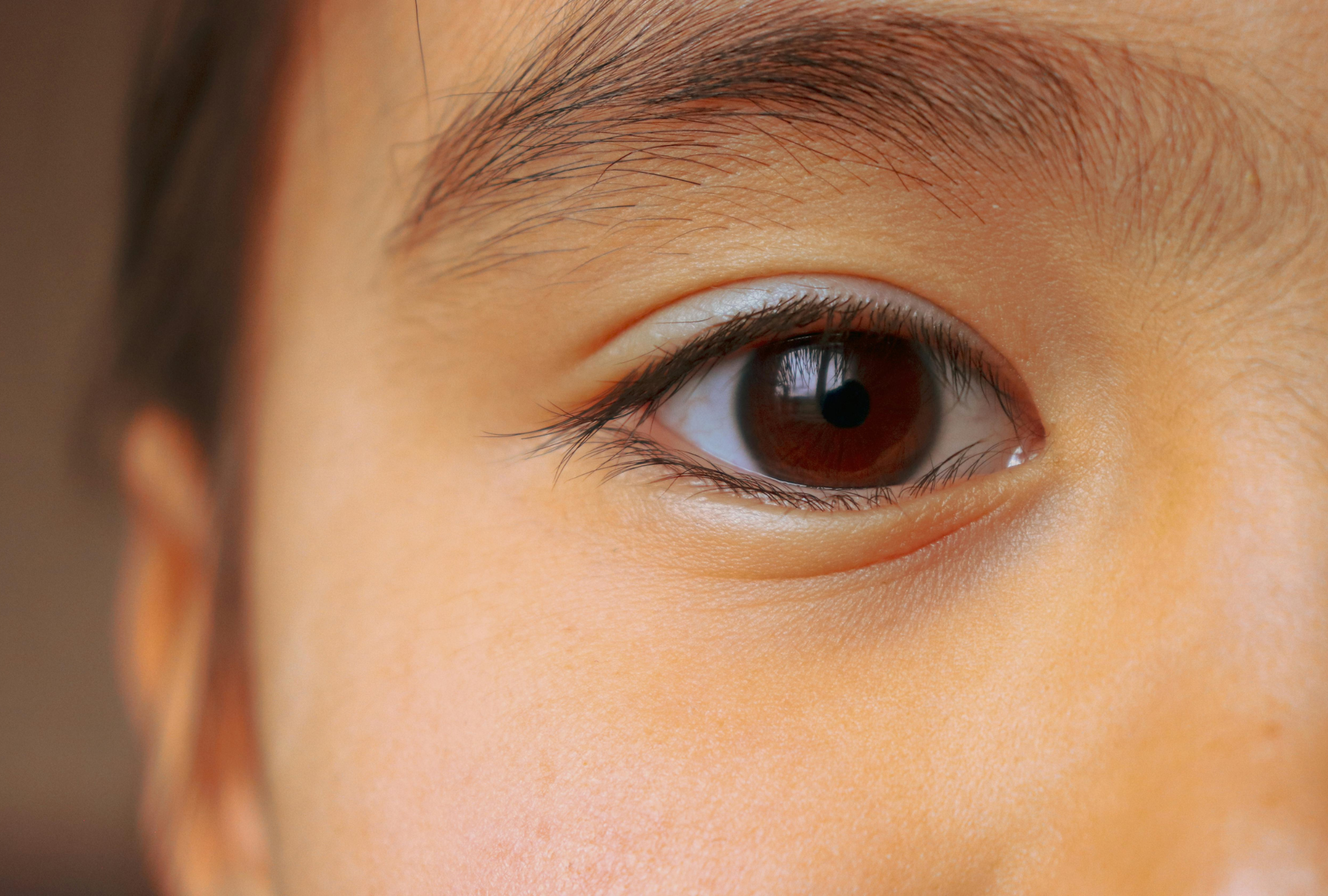 Child's eye closeup representing vulnerability and the need for estate planning and guardian protection for parents