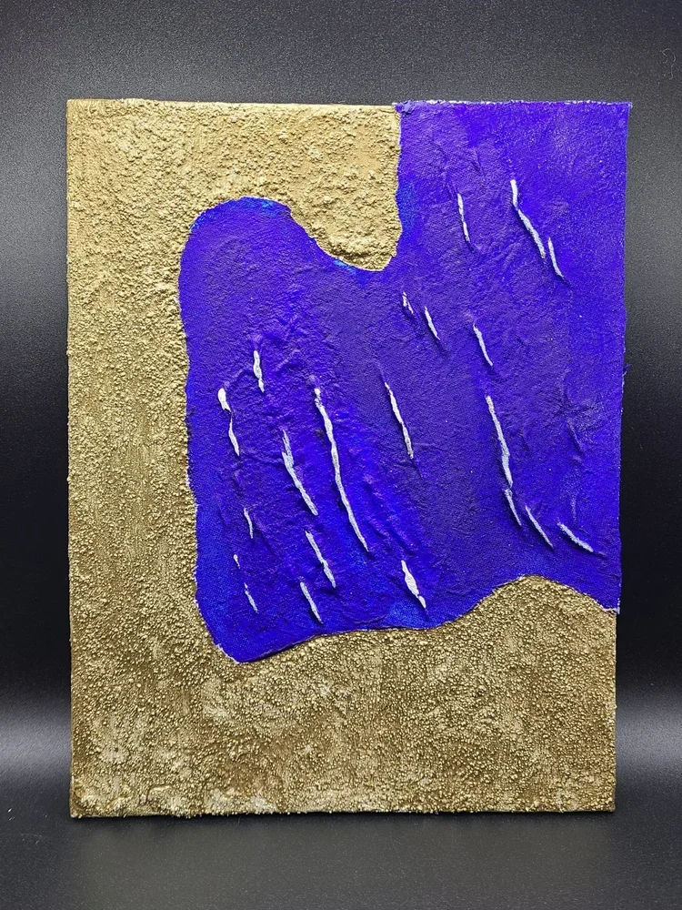 A textured art piece featuring a gold and purple color scheme with abstract shapes and lines.