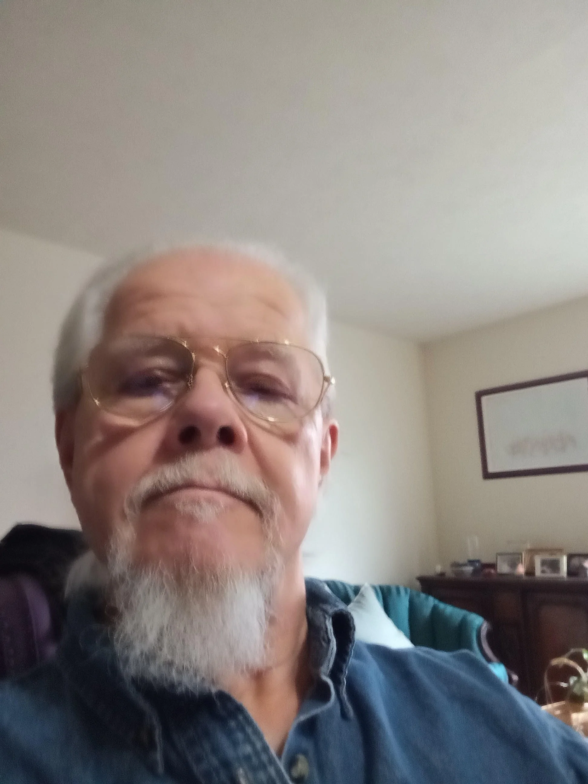 Gray background with black initials 'DG' centered.