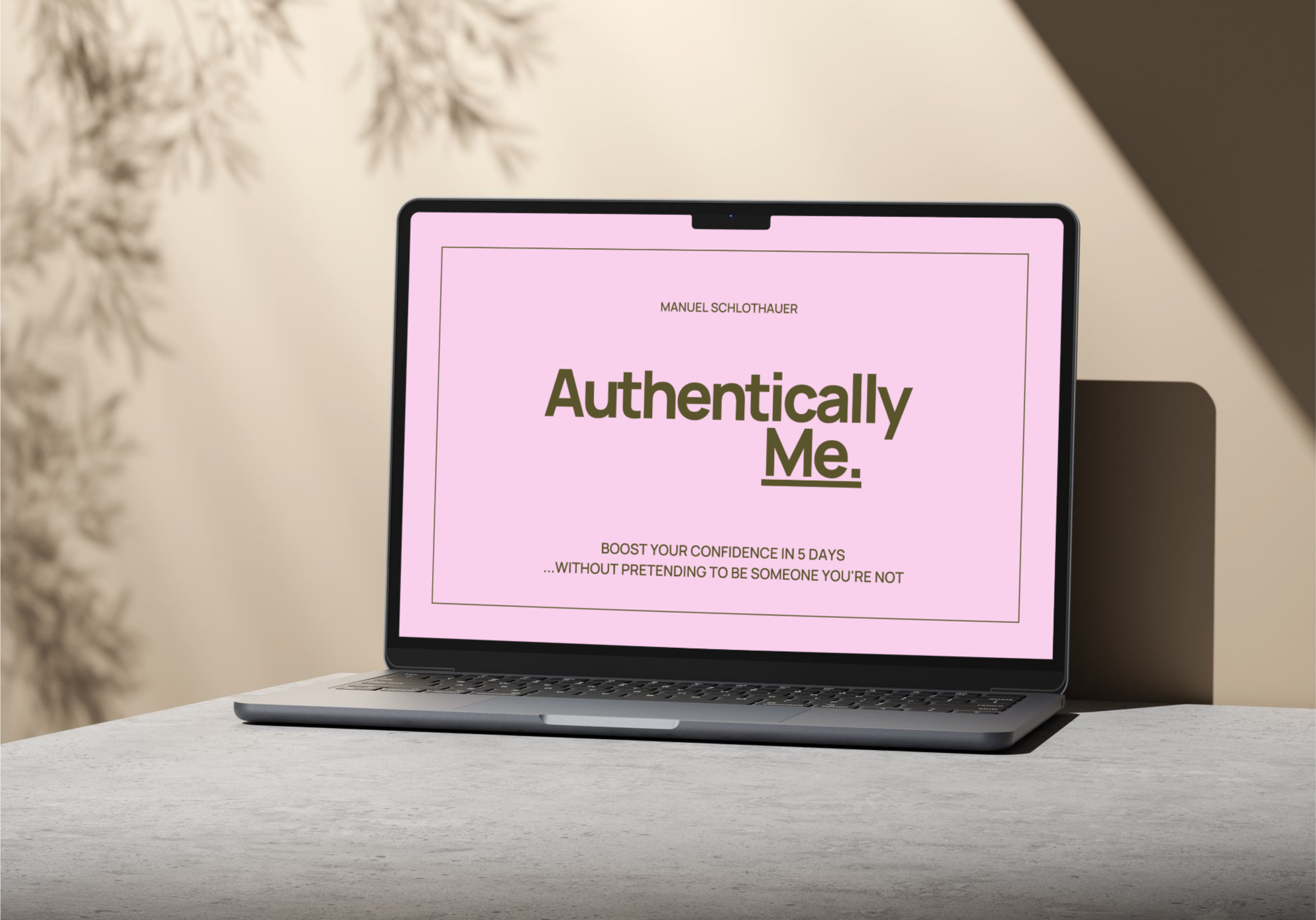 Open laptop on a white desk displaying a book cover titled 'Authentically Me' by Manuel Schlothauer, with subtitle about boosting confidence in five days.