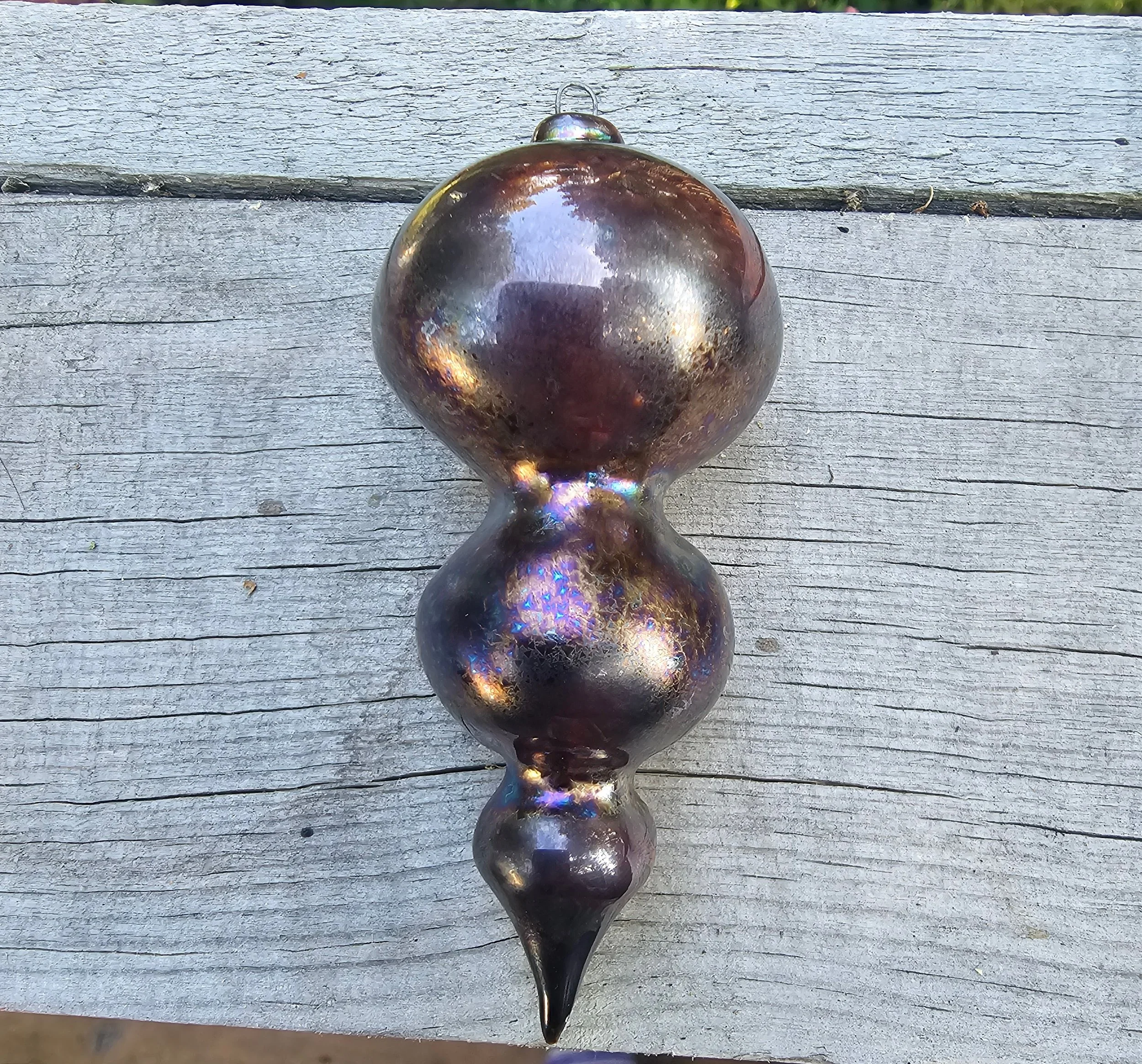 Christmas ornament with a purple glaze.