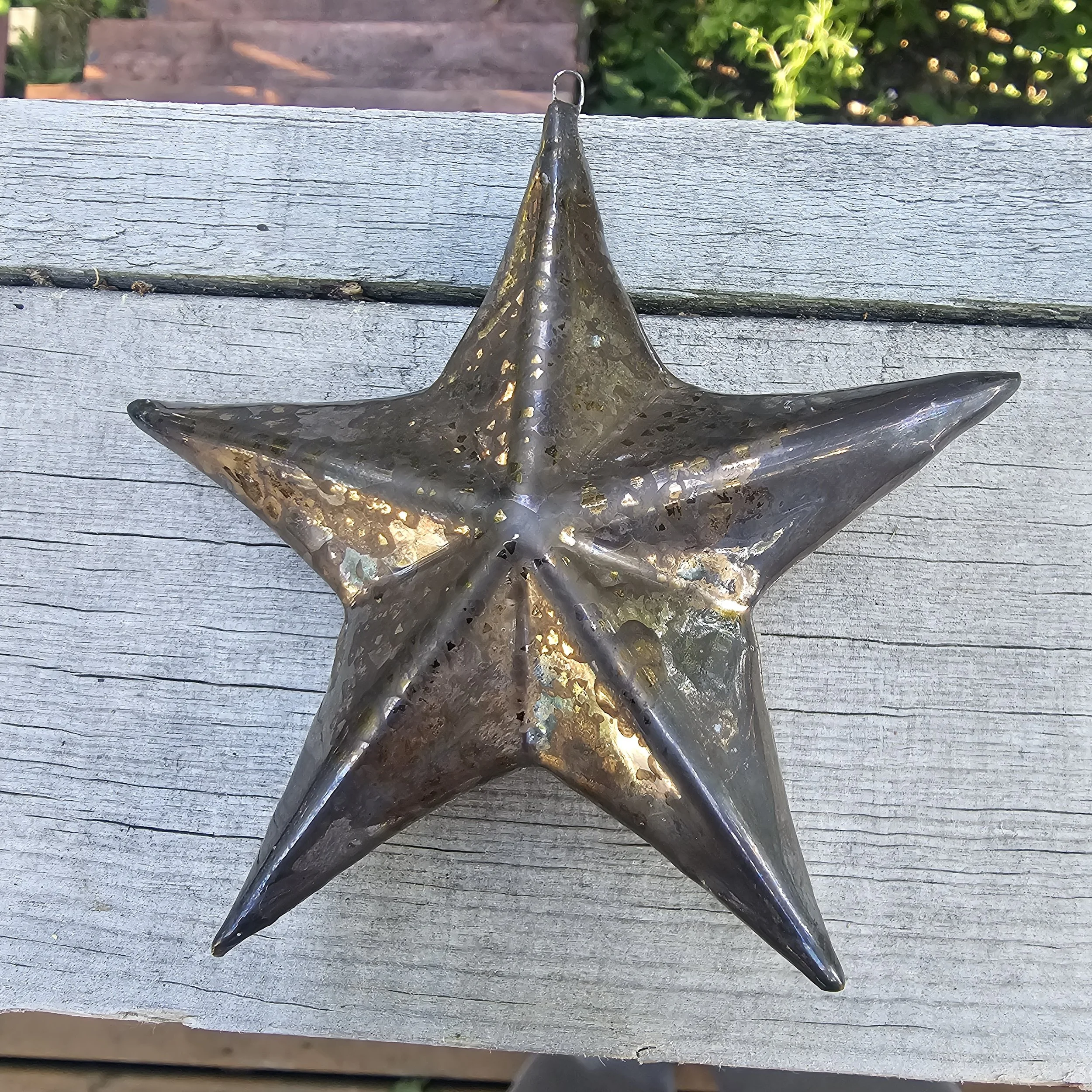 Ceramic Christmas Star with an antique gold glaze.
