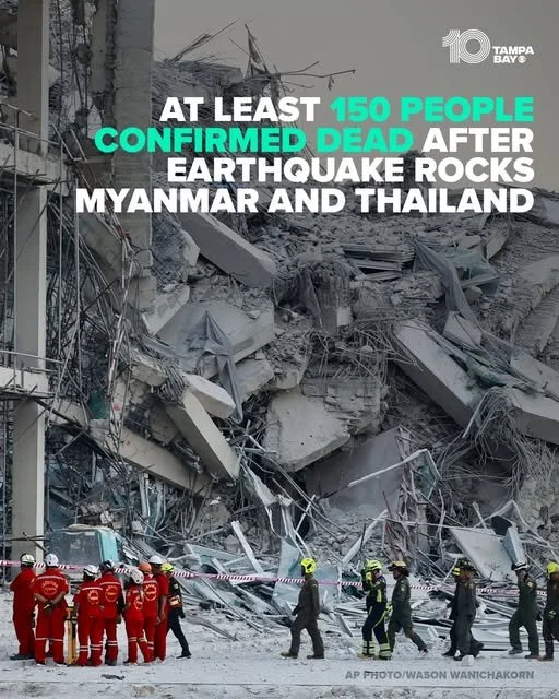 Image shows rescue workers and officials at the site of a building collapse caused by an earthquake, with debris and fallen concrete. The text overlay reports at least 150 confirmed deaths from the earthquake in Myanmar and Thailand.