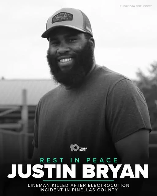 A smiling man wearing a baseball cap and a t-shirt, with text honoring Justin Bryan, a lineman who was killed after electrocution in Pinellas County.