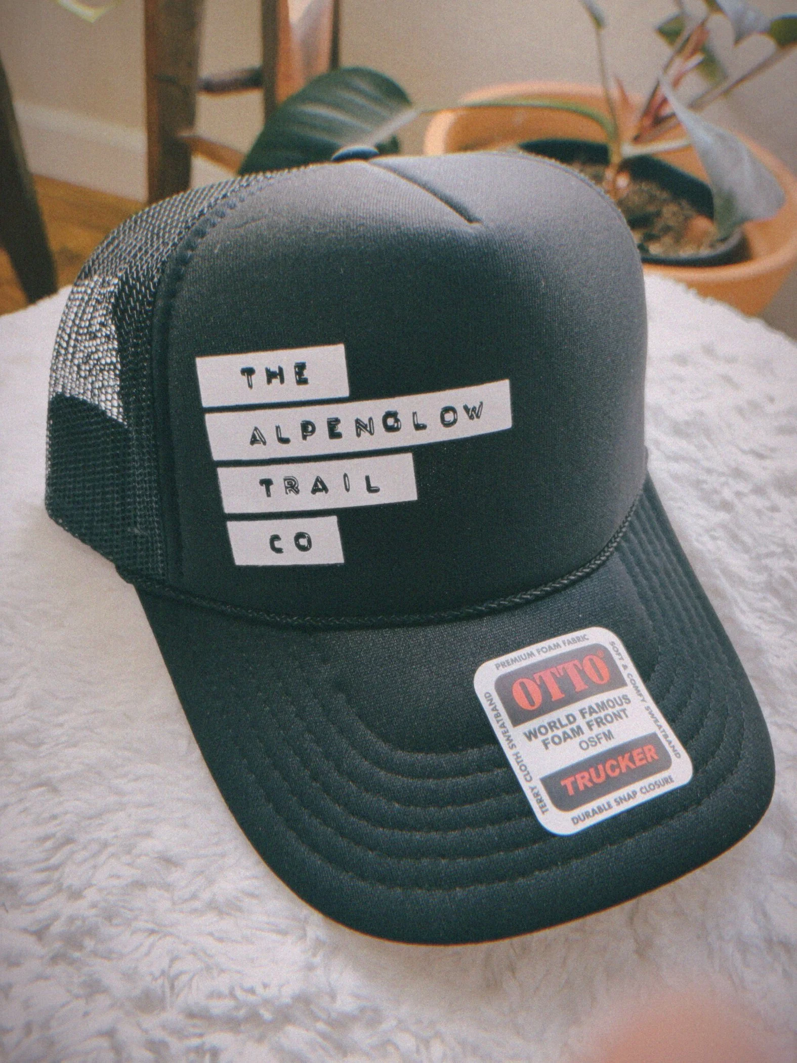 the alpenglow trail co - trucker hat - black + white