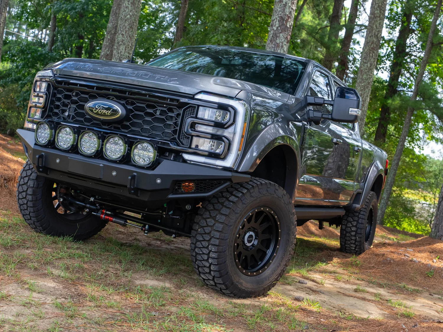 Ford F-250 Super Duty Black Ops by Tuscany front three-quarter view with LED light bumper and lifted stance at Town and Country Ford of Nashville