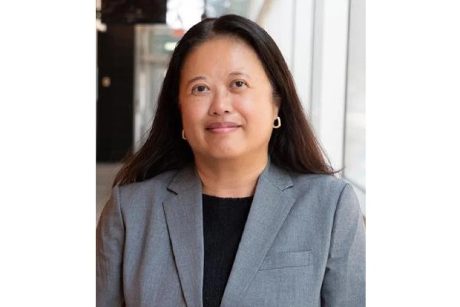 Hope Anderson, Dean of the College of Pharmacy at the University of Manitoba, smiling in a grey blazer