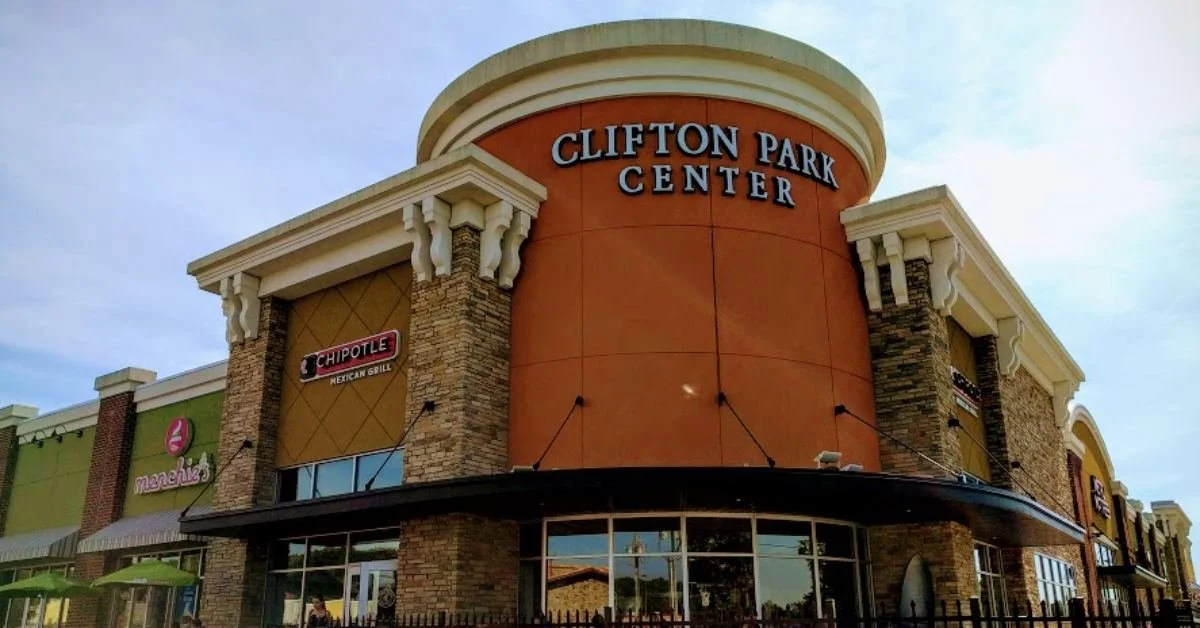Exterior view of Clifton Park Center shopping mall with signs for Chipotle Mexican Grill and Menchie's frozen yogurt.