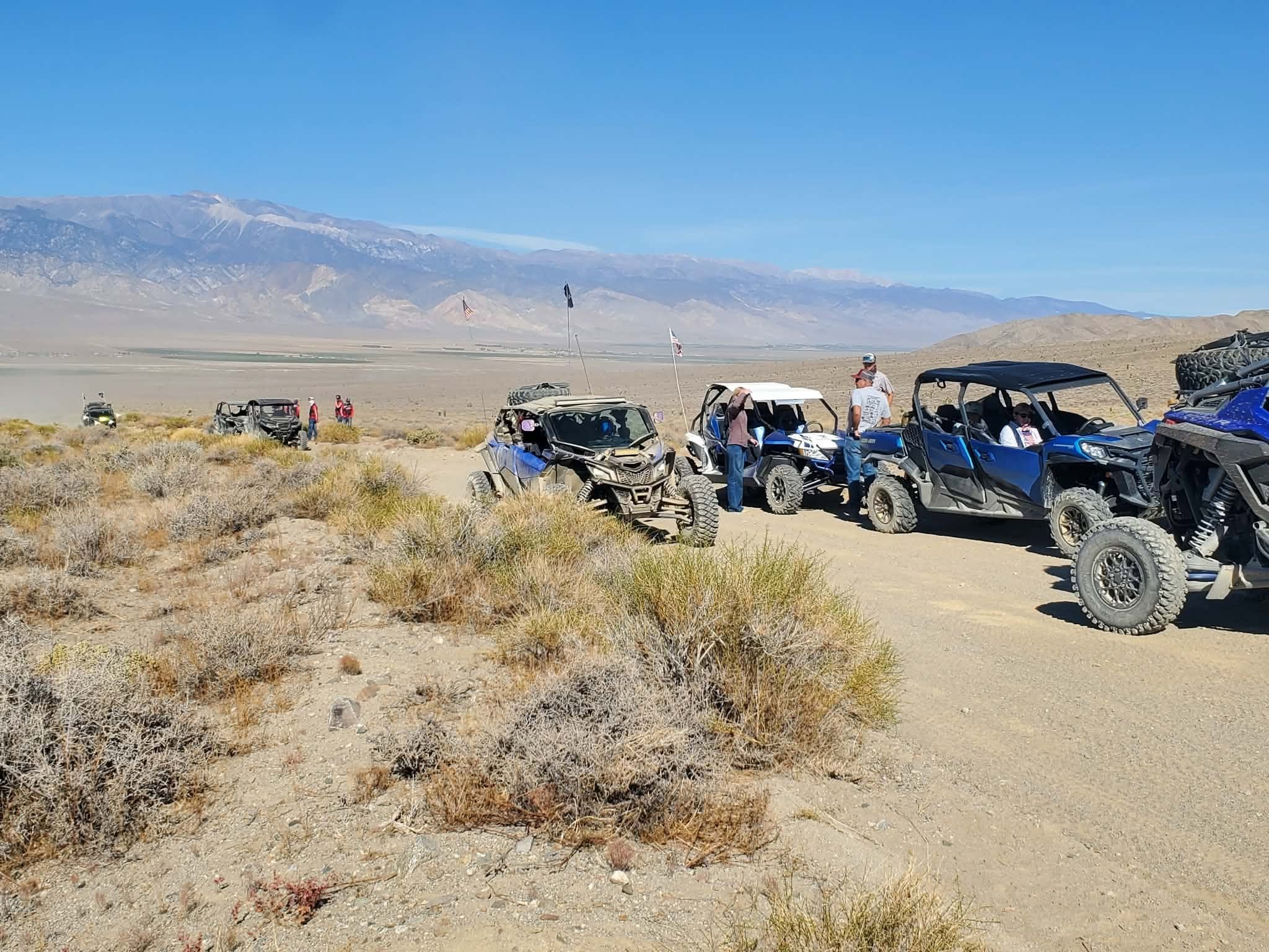 Blue off-road UTVs parked together on the desert trail during the 2026 Dyer - Fish Lake Poker Run