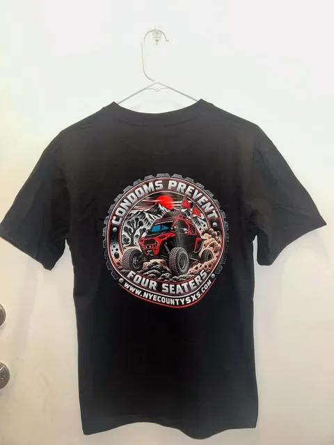 Black Nye County SXS graphic tee, back print showing the "Condoms Prevent Four Seaters" off-road UTV design