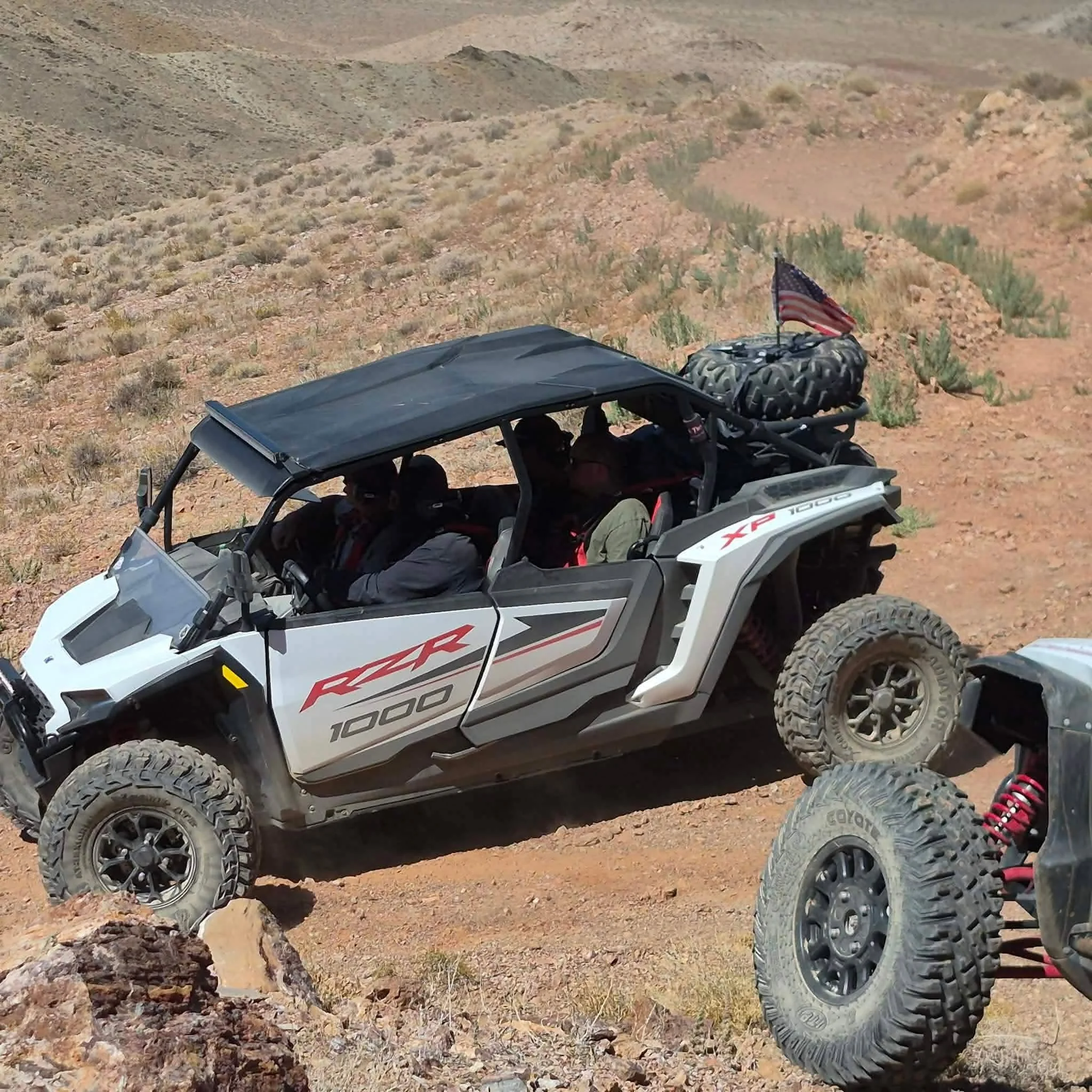 Nye County SxS members riding a Polaris RZR side-by-side on the trail at the 2026 Dyer - Fish Lake Poker Run in Nevada