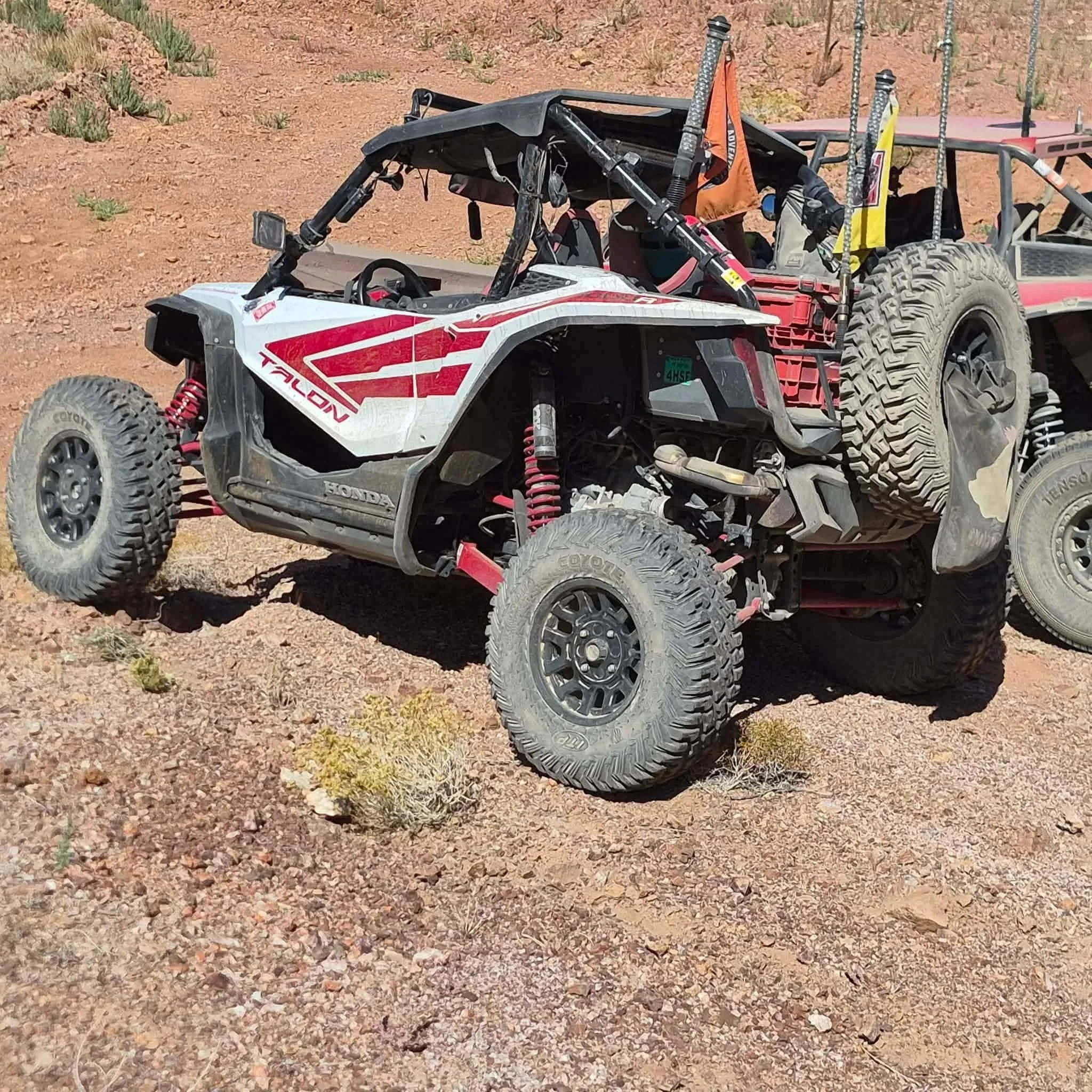 Close-up of a Honda off-road UTV's heavy-duty suspension and tires on the trail at the 2026 Dyer - Fish Lake Poker Run