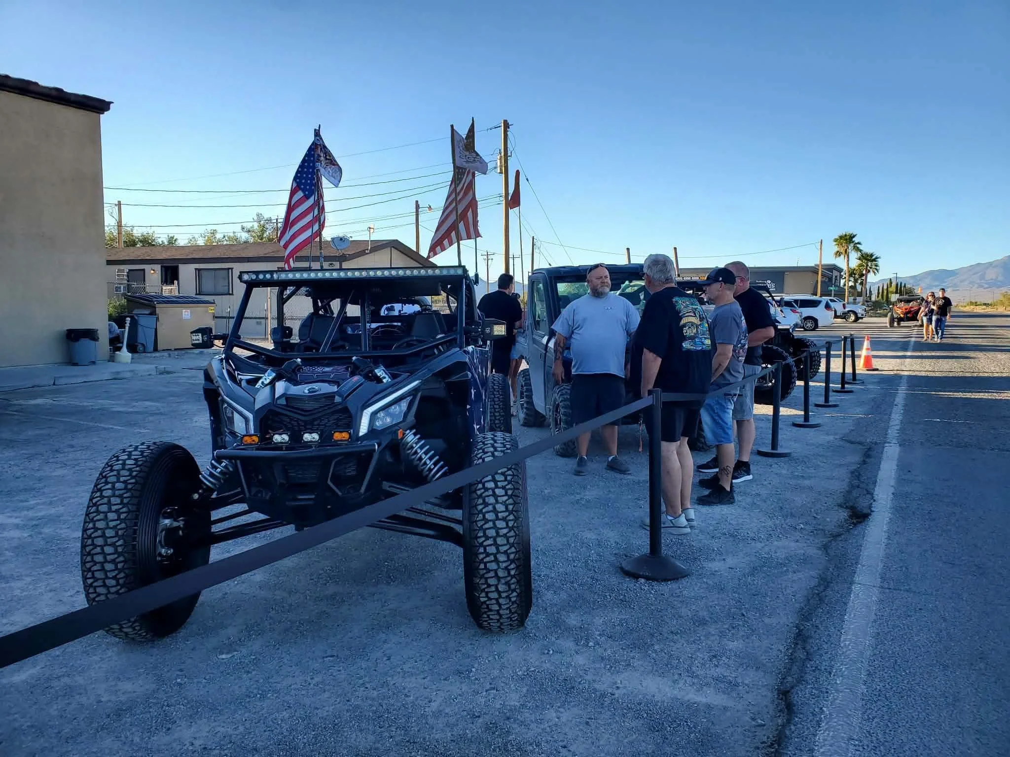 Nye County SxS club members standing beside a UTV with a light bar at the September 2026 monthly meet in Pahrump, NV